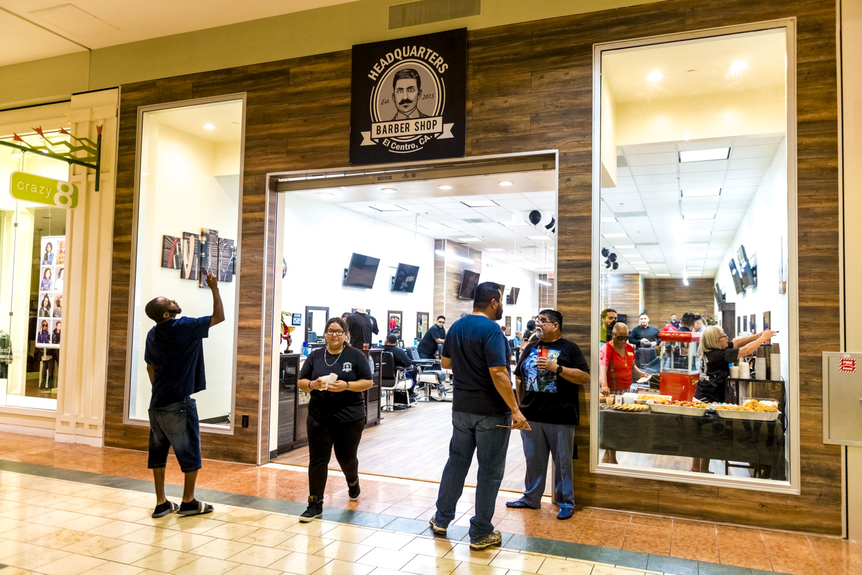 Headquarters Barbershop celebrated the grand opening of their new, larger location inside the Imperial Valley Mall
